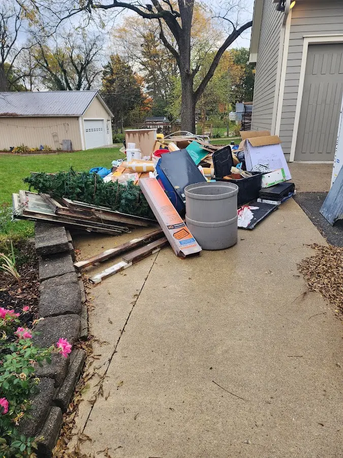 Dumpster being loaded with debris for Commercial Dumpster Rental in Coshocton